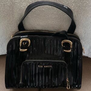 Ted Baker Glossy Black Satchel with Gold Accents